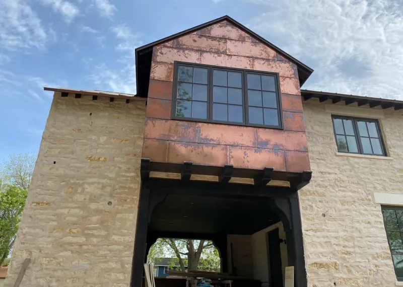 Copper metal panel facade on a stone building for Metal Roof Coating in Brea